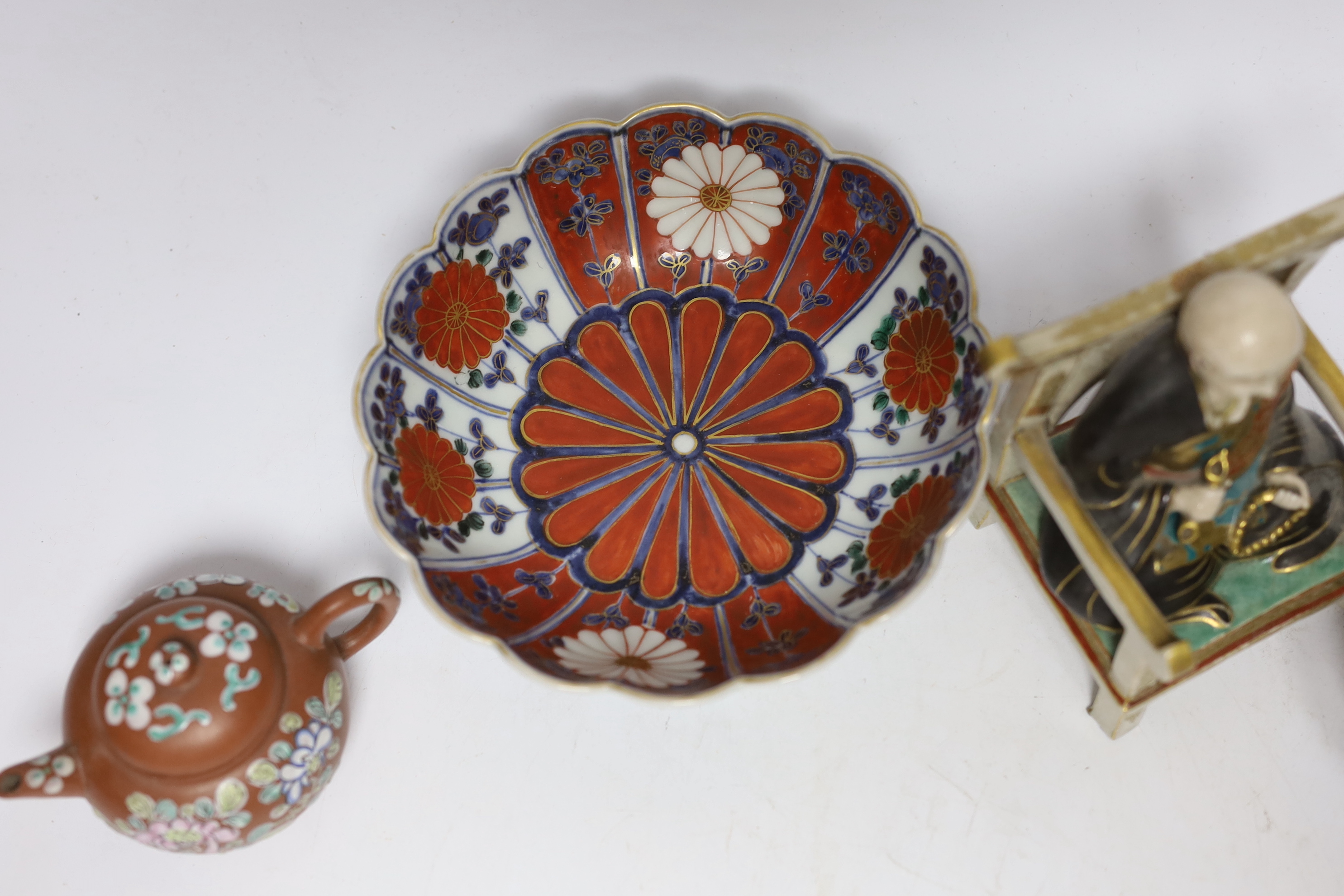 A Chinese enamelled yixing teapot and cloisonné bowl together with a Japanese Imari bowl and a Satsuma seated figure of a Buddhist monk, tallest 14cm